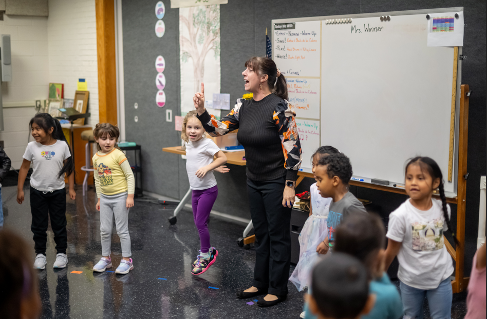 Mrs. Winner, Music teacher, working with Kindergarteners in class